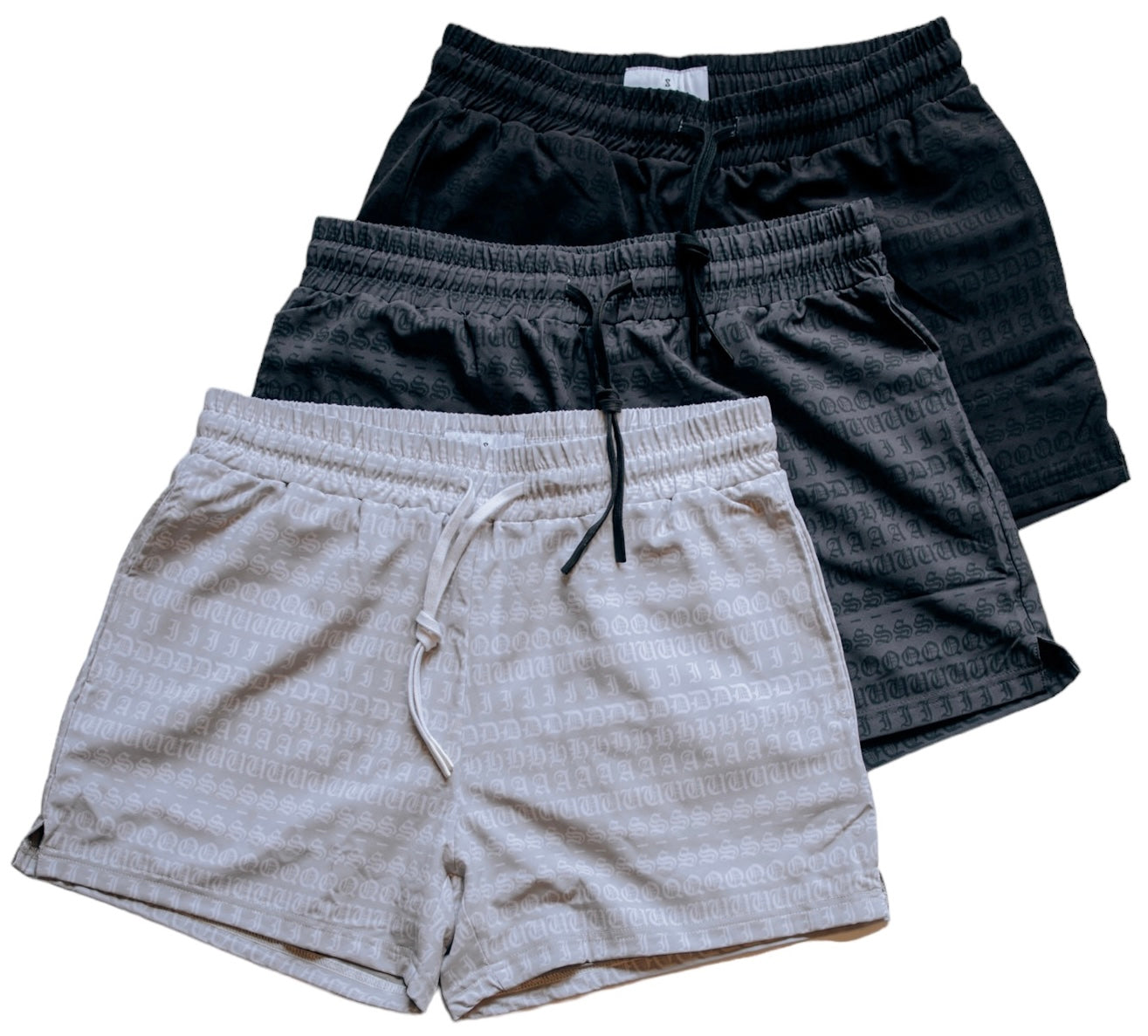 A 3 pack of men's 4 inch inseam mesh shorts in white, gray and black, from SquidHaus